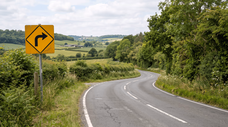 Right turn warning sign indicating a sharp right turn ahead