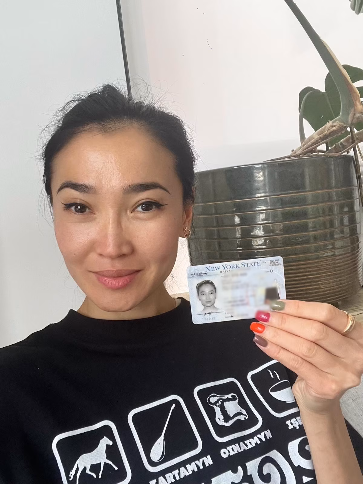 Driver holding their new license