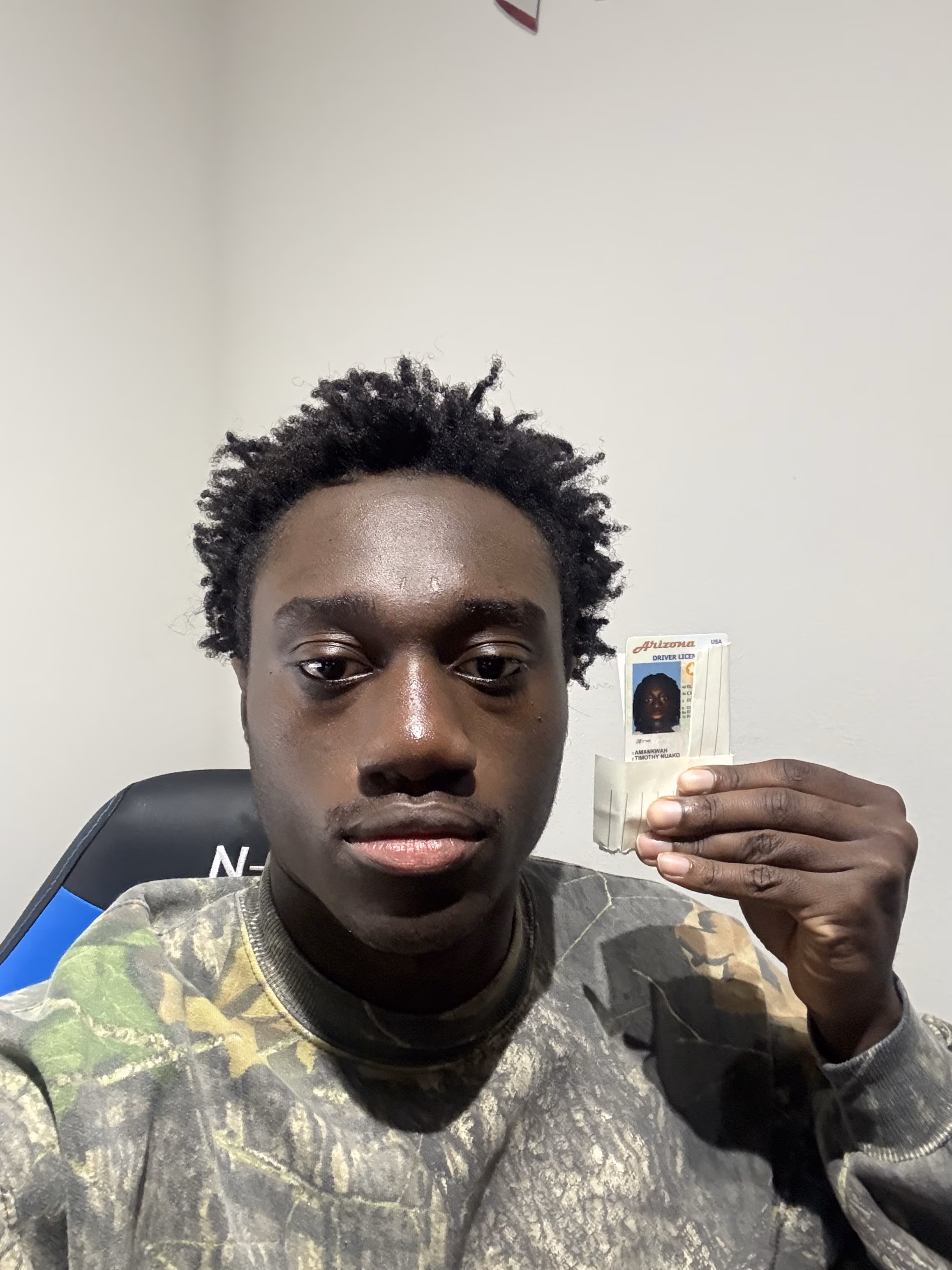 Driver holding their new license